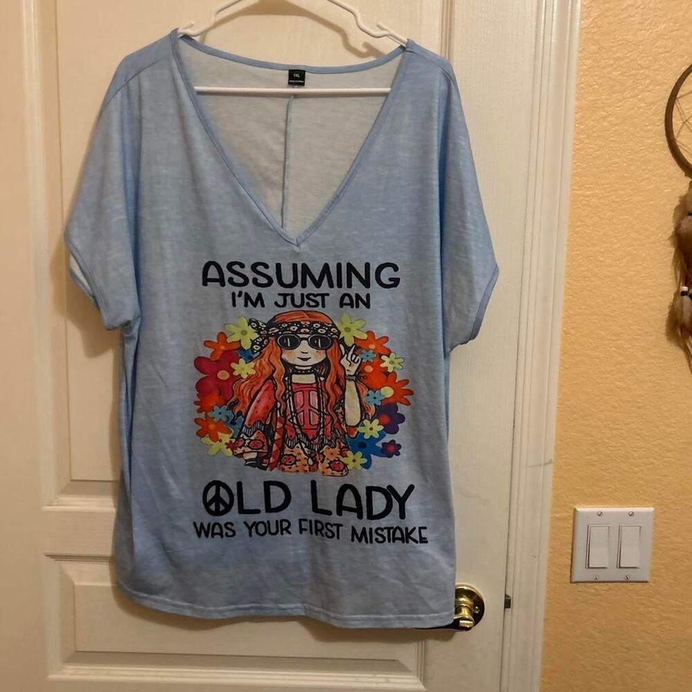 Blue graphic tee with assuming